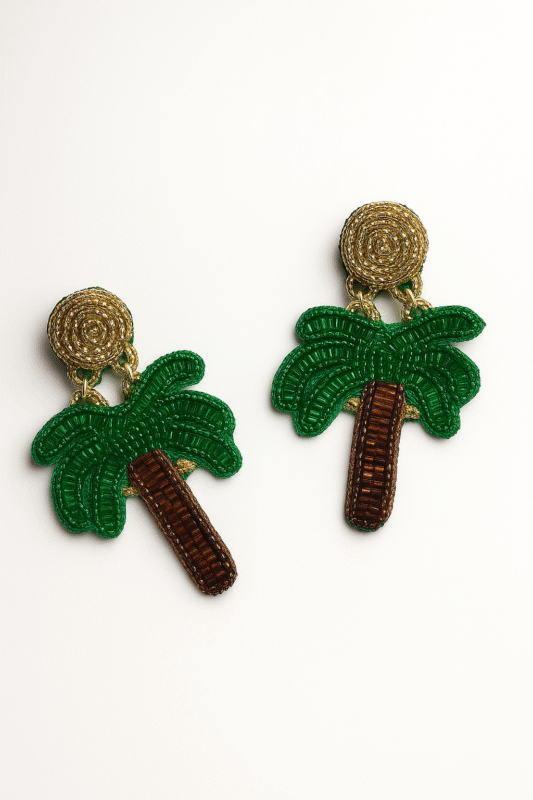 Beaded earrings shaped like palm trees with green leaves and brown trunks, attached to gold circular tops.
