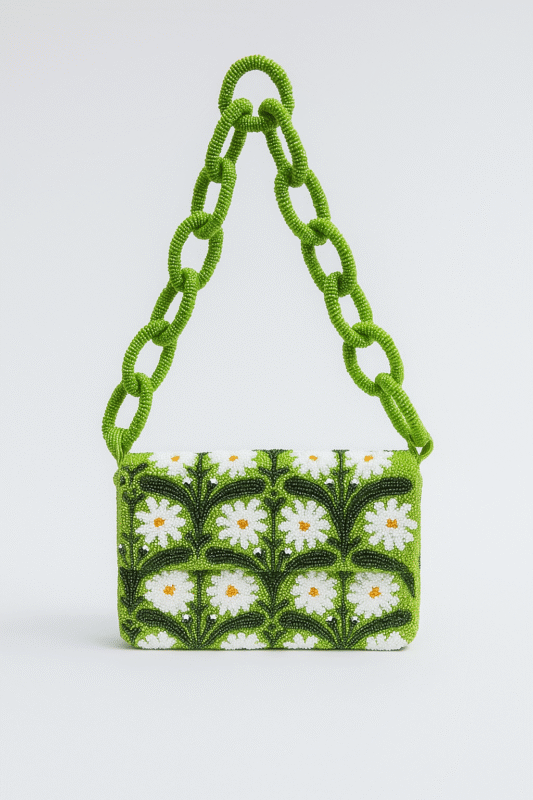 Green hand-beaded clutch decorated with white daisy flowers and a chunky beaded chain strap