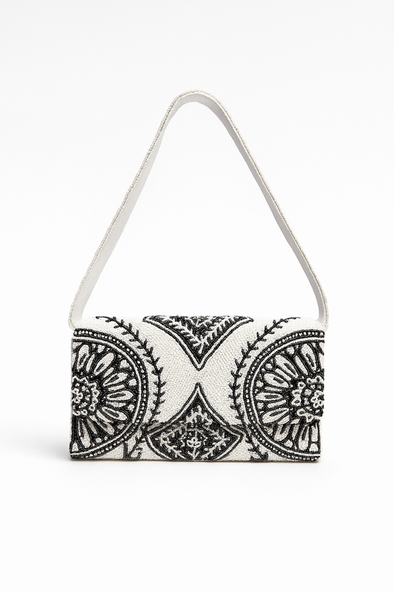 White and black Opulent Orbit hand-beaded clutch featuring luxurious circular mandala patterns and a matching beaded shoulder strap
